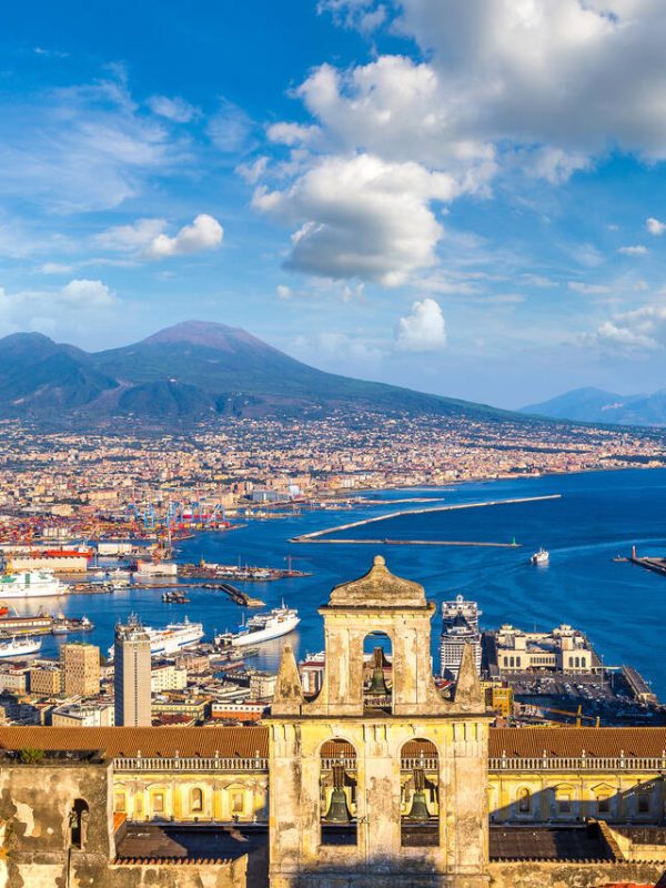 Napoli (Naples) and mount Vesuvius in the background at sunset in a summer day, Italy, Campania