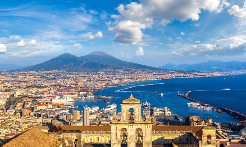 Napoli (Naples) and mount Vesuvius in the background at sunset in a summer day, Italy, Campania